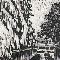 black and white print of alleyway into neighbourhood with trees covered in snow